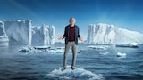 Key art for Season 12 of Curb Your Enthusiasm: Larry David stands on a small ice floe in the ocean, shrugging, surrounded by icebergs under a clear blue sky.