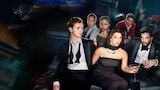 A stylish group of young professionals in formal evening wear sit in a dimly lit lounge. The mood is tense and glamorous, with cocktails in hand and intense expressions suggesting ambition, power plays, and hidden agendas.