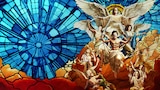 A dramatic stained glass-style image depicting shirtless, muscular men wielding swords and ascending with angels amid swirling blue and gold light. At the top, a radiant figure with wings and outstretched arms watches over them, evoking a heavenly, apocalyptic scene filled with biblical imagery and emotional intensity.